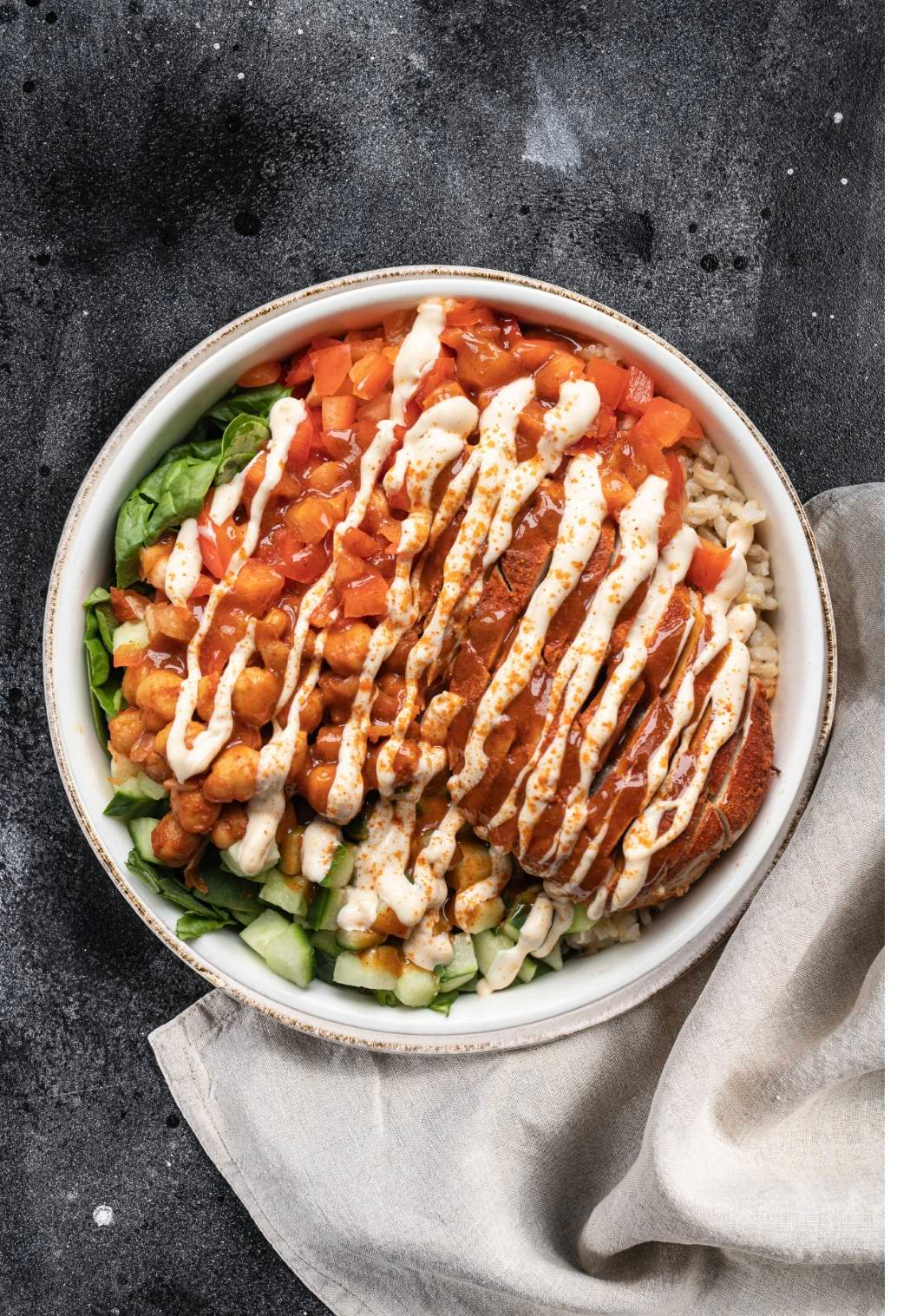 The Whole Bowl macro-balanced bowl with rice, chickpeas, cucumber, spinach, and sauce, made fresh in Surrey BC